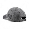 Rear view of gray baseball cap with adjustable strap and black American flag patch on back panel.