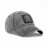 Angled front view of gray cap featuring FNH Firearms logo patch