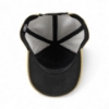 Interior view of tan perforated baseball cap showing black inner lining and structured crown.