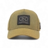 Front-facing view of tan cap with FNH Firearms logo patch centered on front panel.